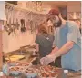  ?? USA TODAY ?? Maine Huts & Trails staff prepare dinner.