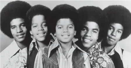  ?? MICHAEL OCHS ARCHIVES VIA GETTY IMAGES ?? The Jackson 5 bring true glee to 1970’ s “I Saw Mommy Kissing Santa Claus.”