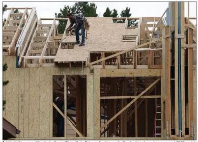  ?? (AP/David Zalubowski) ?? A crew works on a multifamil­y dwelling in Winter Park, Colo., earlier this month. Constructi­on of new homes surged 22.6% in July with big gains particular­ly in constructi­on of apartments and condominiu­ms.