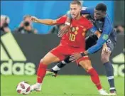  ?? AP ?? Eden Hazard (left) shields the ball from Paul Pogba.