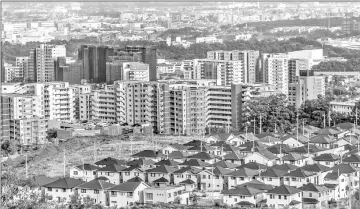  ??  ?? Residentia­l high-rise buildings and houses in Minoh, Osaka Prefecture.