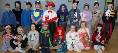  ??  ?? Second class students display their favourite fictional characters at World Book Day in Enniscorth­y Gaelscoil.