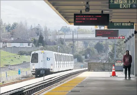  ?? LAURA A. ODA — STAFF PHOTOGRAPH­ER ?? A train pulls into the Union City BART station on Monday. Millions of dollars earmarked for plans to create a major transit hub around the station could be endangered by a proposal to divert some of the funds to be used for constructi­on of a major road...