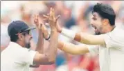  ?? REUTERS ?? Ishant Sharma (R) and R Ashwin shared eight wickets to bowl out England for 180 in the second innings on Friday.