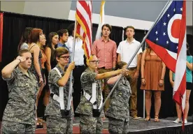  ?? MARSHALL GORBY / STAFF ?? The presentati­on of colors by the Little Miami High School ROTC, and the singing of the National Anthem by the Springboro High School choir at the Warren County Fair Veterans Program in July 2021.