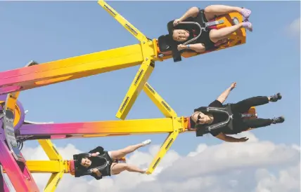  ?? JASON PAYNE ?? Some lucky students check out the midway rides during a visit to Playland on Friday for a sneak preview of the attraction­s. The fun-filled outing was a welcome part of a school assignment.