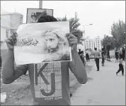  ?? Ahmed Alfardan
European Pressphoto Agency ?? I N BAHRAIN, where a Saudi- backed monarchy rules a majority- Shiite population, a protester holds Al- Nimr’s picture. Protests also erupted in Lebanon.