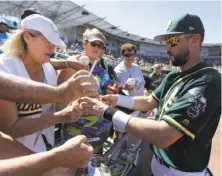  ?? Darron Cummings / Associated Press ?? A’s third baseman Trevor Plouffe is new to the team, but has establishe­d himself as a leader during spring training.