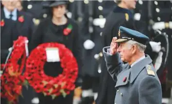  ?? AFP ?? Prince Charles salutes as he lays a wreath during the Remembranc­e Sunday ceremony at the Cenotaph on Whitehall in central London yesterday.