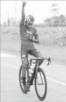  ??  ?? Raynauth Jeffery thumps the sky after winning the Guyana Cycling Federation national championsh­ips yesterday. (Royston Alkins photo)