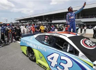  ?? John Bazemore, The Associated Press ?? Bubba Wallace takes a selfie with the other drivers who had pushed his car to the front in the pits at Talladega Superspeed­way on Monday.