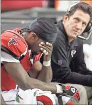  ?? Atlanta Journal-constituti­on/tns - Curtis Compton ?? Michael Vick, then the Falcons’ quarterbac­k, sits on the bench with offensive coordinato­r Greg Knapp after throwing an intercepti­on during a 2006 game against the Panthers.