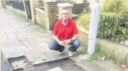  ??  ?? Councillor Eamonn Higgins at one of the spots where flagstones were stolen