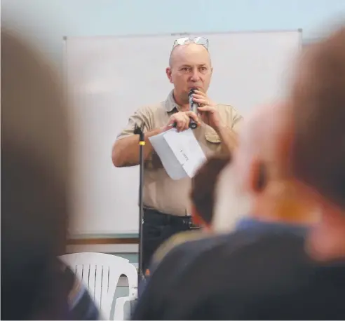  ?? Picture: STEWART MCLEAN ?? SEEKING SOLUTIONS: Attila Feher-Holan addresses Saturday’s meeting at Woree Community Hall.