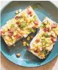  ??  ?? Ricotta toasts with melon and salami.