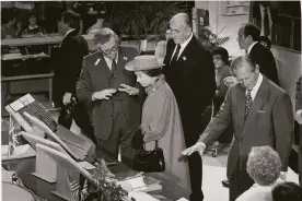  ?? Michael Maloney / The Chronicle 1983 ?? Above: Queen Elizabeth II, alongside husband Prince Philip (right), listens to Hewlett-Packard co-founder David Packard while touring the firm’s ’s Palo Alto home in March 1983. Top: Elizabeth, flanked by Mayor Dianne Feinstein and Philip, attends a reception at S.F.’s Davies Symphony Hall that week.