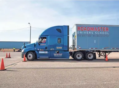  ?? ARIEL COBBERT/THE COMMERCIAL APPEAL ?? Rhonda Wilkins backs up a tractor-trailer during driving instructio­n training at Roadmaster Drivers School in Millington, Tenn., on Jan. 14.