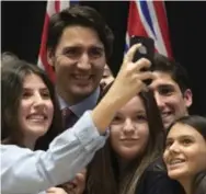  ?? ADRIAN WYLE/THE CANADIAN PRESS ?? Like his father before him, Prime Minister Justin Trudeau is redefining Canada as a country that’s hip, young and on the move.