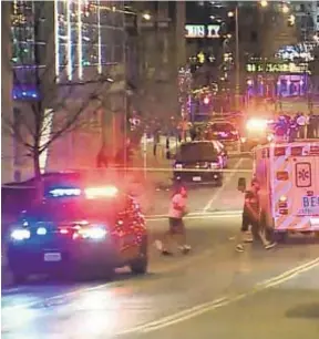  ?? WISN 12 NEWS VIA AP ?? Police respond after shooting at Water Street and Juneau Avenue in Milwaukee as nights of violence erupt near Bucks’ arena.