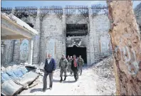  ?? AP PHOTO ?? Russian military police officers check a weapons factory left behind by members of the Army of Islam group, in the town of Douma, the site of a suspected chemical weapons attack, near Damascus, Syria, Monday.