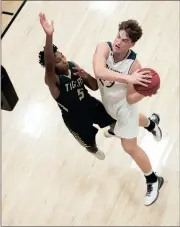  ?? TIM GODBEE / For the Calhoun Times ?? Calhoun’s Davis Allen (right) goes up for a shot over Adairsvill­e’s Cody Henderson in the first half.