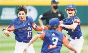  ?? Joshua Bessex / Getty Images ?? Michigan’s Max LaForest (17), Gavin Ulin (3) and Lucas Farner celebrate winning the 2021 Little League World Series game against Team Ohio at Howard J. Lamade Stadium on Sunday in Williamspo­rt, Pa.