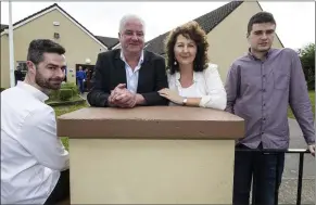  ??  ?? Cáit Daly pictured withher husband, Mike and sons, Seán (left) and Kevin at her retirement function at Scoil Íde, Curranes.