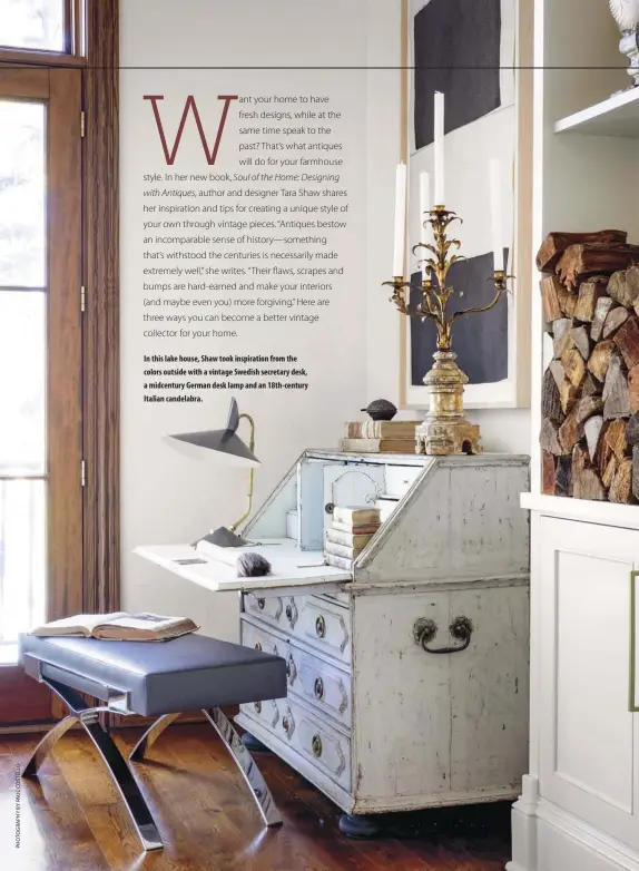  ??  ?? In this lake house, Shaw took inspiratio­n from the colors outside with a vintage Swedish secretary desk, a midcentury German desk lamp and an 18th-century Italian candelabra.