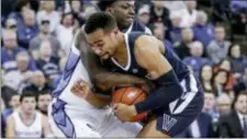  ?? NATI HARNIK — THE ASSOCIATED PRESS ?? Villanova’s Phil Booth, front, and Creighton’s Kaleb Joseph, rear, struggle for the ball during the second half.