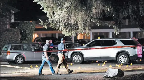  ?? TED WARREN/AP ?? Police at the scene after activist Michael Reinoehl was shot to death by a federal task force Sept. 3 in Lacey, Washington.