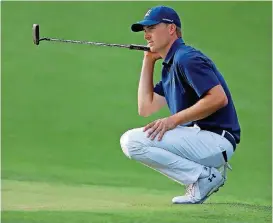  ?? [AP PHOTO] ?? Jordan Spieth looks over his birdie putt on the 17th green during the first round at the Masters golf tournament on Thursday. Spieth is the first round leader.