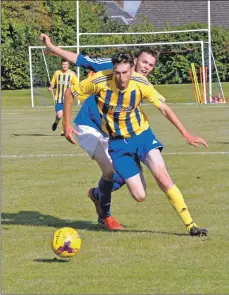  ?? 01_B36footy04 ?? Ryan Armstrong gets away from Matthew Dobson.