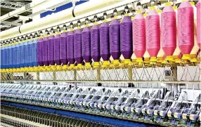  ?? ?? Fabric production line at an apparel factory