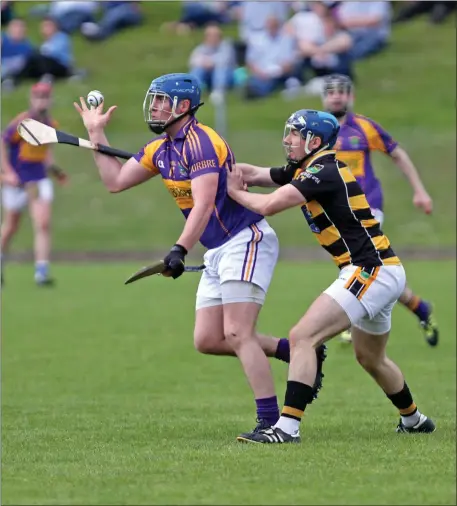  ??  ?? Diarmuid O’Donovan, Carbery and Eoin Clancy, Avondhu in action during their County SHC first round clash in Coachford on Sunday afternoon Photo by Jim Coughlan