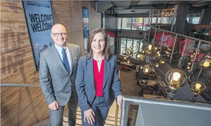  ?? PETER J. THOMPSON ?? Boston Pizza’s Alan Howie, executive vice-president of operations and developmen­t, and Helen Langford, senior vice-president of food services, at the company’s new flagship outlet in downtown Toronto. It plans another 25 urban locations in the next few years across Canada.