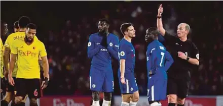  ?? EPA PIC ?? Chelsea’s Tiemoue Bakayoko (centre) walks out after being sent off by referee Mike Dean in the match against Watford on Monday. Watford won 4-1.