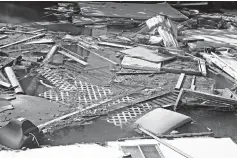  ?? Photos by Charles Trainor Jr./ Miami Herald/TNS ?? fourth row
Debris sits in a canal on Marathon in the Florida Keys.