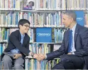  ?? SUSAN WALSH/AP ?? President Barack Obama shakes hands with sixth-grader Osman Yaya from Salisbury, Md.