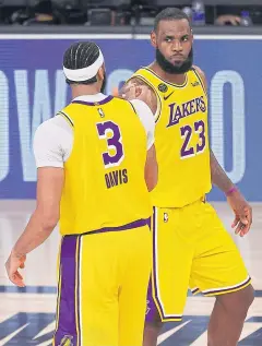  ?? AFP ?? The Lakers’ Anthony Davis, left, and LeBron James celebrate their win.