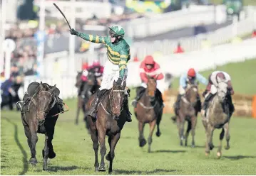  ??  ?? Mark walsh riding Espoir D’Allen win The Unibet Champion Hurdle at Cheltenham