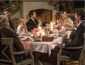  ?? Home Again. ?? Lillian (Candice Bergen), Austen (Michael Sheen), Rosie (Eden Grace Redfield), Teddy (Nat Wolff), Alice (Reese Witherspoo­n), Isabel (Lola Flanery) and Harry (Pico Alexander) dine al fresco in a scene from Hallie Myers-Shyer’s