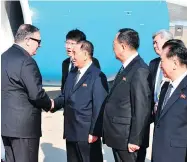  ?? MATTHEW LEE / AFP / GETTY IMAGES ?? U.S. Secretary of State Mike Pompeo, left, is greeted in Pyongyang on Wednesday. Pompeo secured the release of three American prisoners ahead of a planned summit between Kim Jong Un and U.S. President Donald Trump.