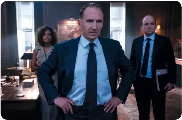  ?? ?? Naomie Harris as Moneypenny, Ralph Fiennes as M, and Rory Kinnear as Tanner confer in M’s office.