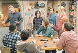  ?? Eric McCandless ABC ?? SPIRITED discussion­s still take place around the kitchen table in the ABC spinoff “The Conners,” which finds the family without its sharp-tongued matriarch.