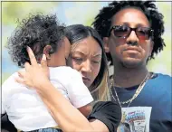  ?? RAY CHAVEZ — STAFF PHOTOGRAPH­ER ?? Salena Manni, fiancee of Stephon Clark, holds one of their two children, Cairo, 1, during an anti-gun violence/anti-police violence rally at Cesar Chavez Park in Sacramento on Saturday.