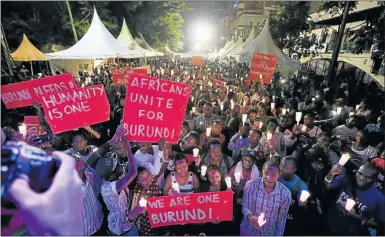  ?? Picture: REUTERS ?? CALL FOR PEACE: People hold candles in Nairobi, Kenya during a street concert organised by activist organisati­on PAWA254 to highlight the violence in Burundi