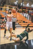  ?? ?? The Lady Tigers Marika Moyer shoots over the Hilltopper­s Dailynn Rodriguez during a home game on Saturday (Jan. 29).