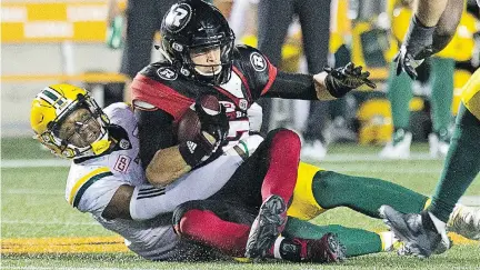  ?? WAYNE CUDDINGTON ?? Ottawa QB Trevor Harris is hauled down in the second quarter Thursday night at TD Place. The Redblacks now sit at 1-6-1.