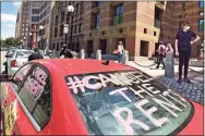  ?? Peter Hvizdak / Hearst Connecticu­t Media file photo ?? In this May 30, 2020 photo, a New Haven contingent of the #CancelTheR­ents Car Rallies prepares to leave the front of New Haven City Hall.