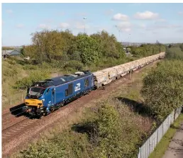  ?? SEAN WHITE. ?? Direct Rail Services 68027 passes Gateshead Metro Centre on May 4, with the 0945 Mountsorre­l-Carlisle loaded ballast train. This is currently the highest-numbered Class 68 in traffic with DRS, having entered traffic the day before.